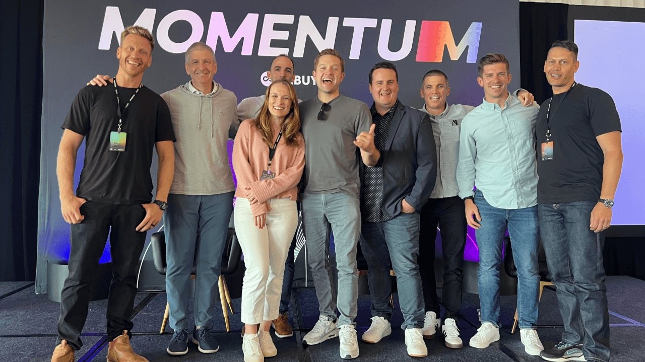 Fluent and Rebuy post on stage at Momentum 2025